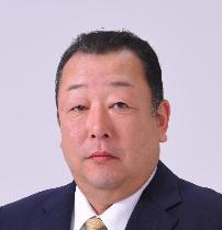 黒いスーツ姿で正面を向いている笑顔の竹内議員の写真